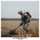 Soldier Using Mine Detector in Field - Cinematic Military Security Stock Video for Tactical and Training Use 1