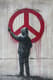 Anonymous Protester Graffiti - Impactful Political & Social Street Art for Contemporary Urban Expression 1