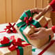 Woman Wrapping Christmas Gifts - Festive Holiday Stock Video for Seasonal Marketing and Creative Projects 5