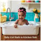 Baby Girl Bath in Kitchen Sink - Heartwarming Lifestyle Stock Video for Family and Children Projects 6