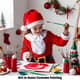Girl in Santa Costume Painting - Festive Holiday Stock Video for Seasonal Marketing and Creative Projects 6