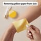 Removing Yellow Paper from Skin - Clean, Natural Lifestyle Stock Video for Family and Children Projects 4